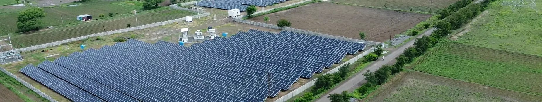 Panoramic aerial view of a ground-mounted solar plant
