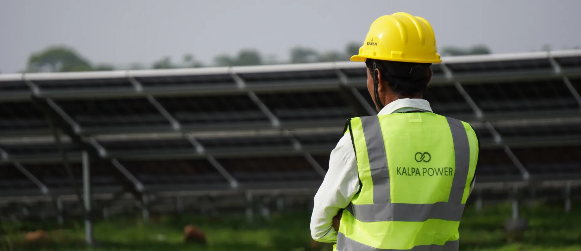 Kalpa Power engineer reviewing a solar array