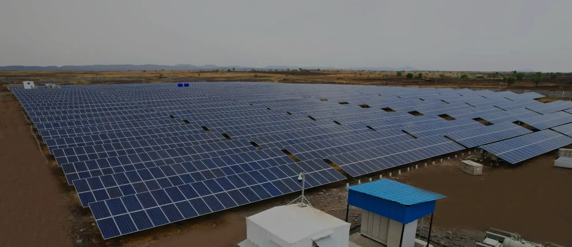 Ground-mounted solar arrays with inverter stations